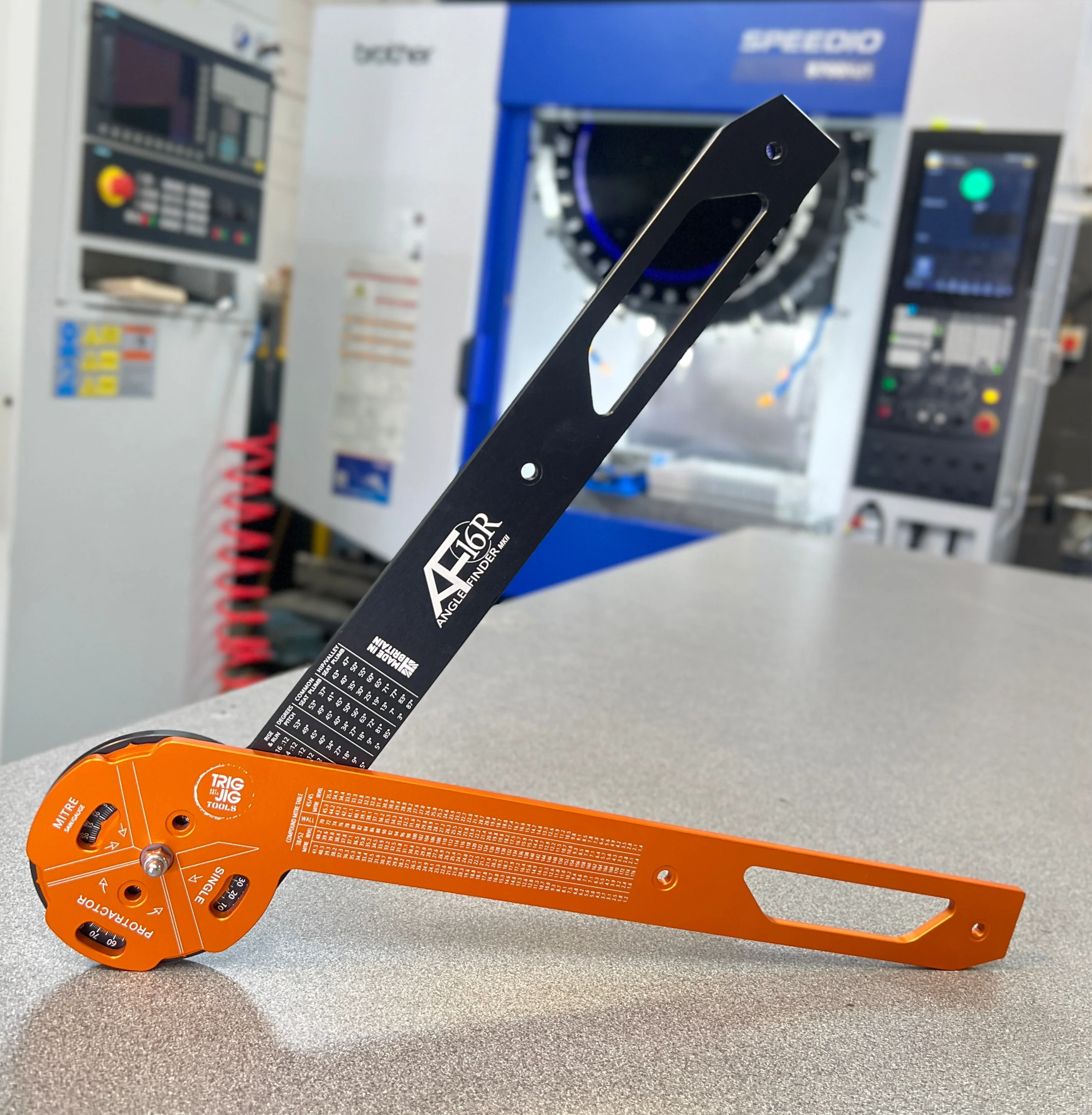 AF16 Angle Finder black & fire model in front of cnc machining center